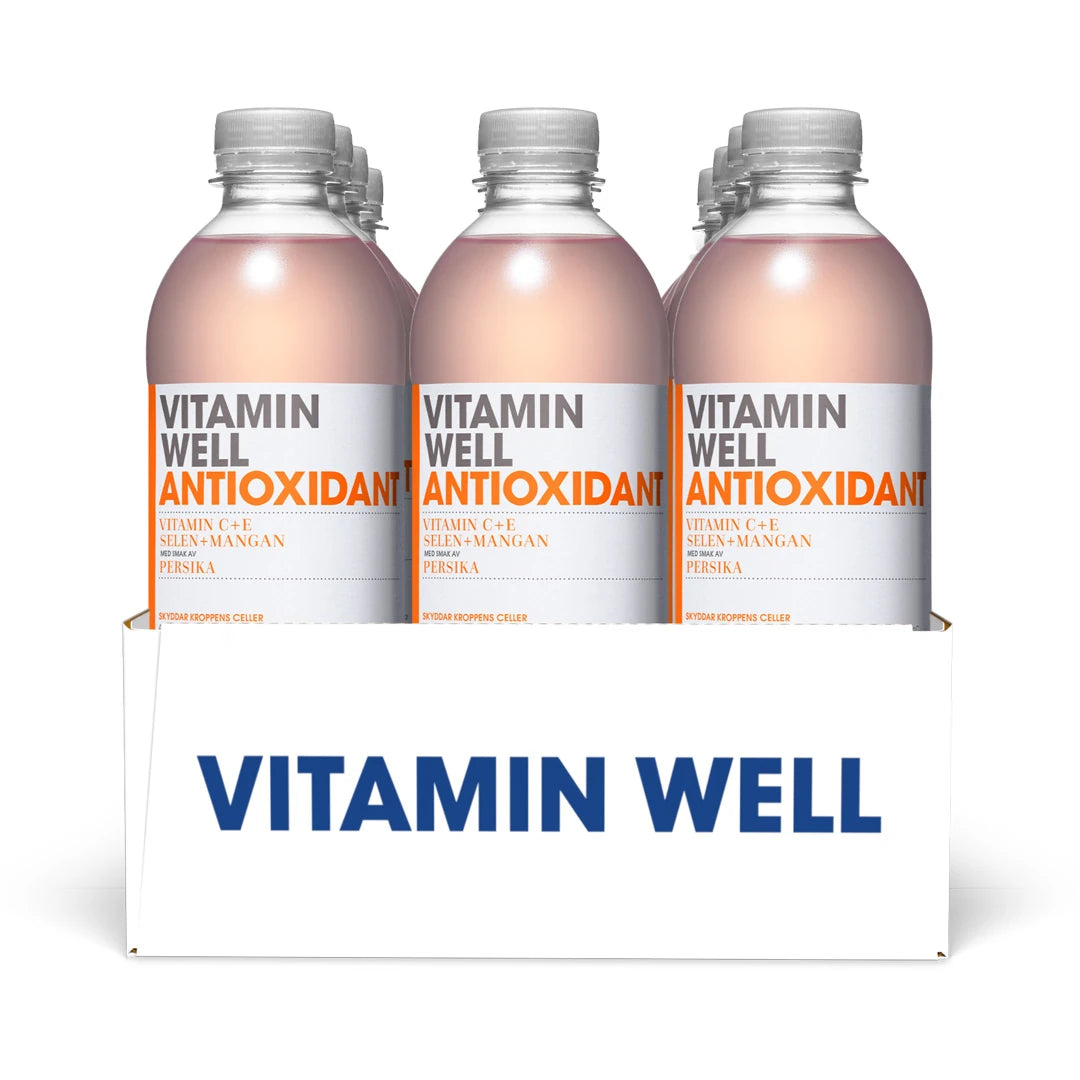 12 x Vitamin Well 500 ml Antioxidant Persika i ett vitt flak med genomskinliga plastflaskor och ljusrosa dryck., bild 1 av 1