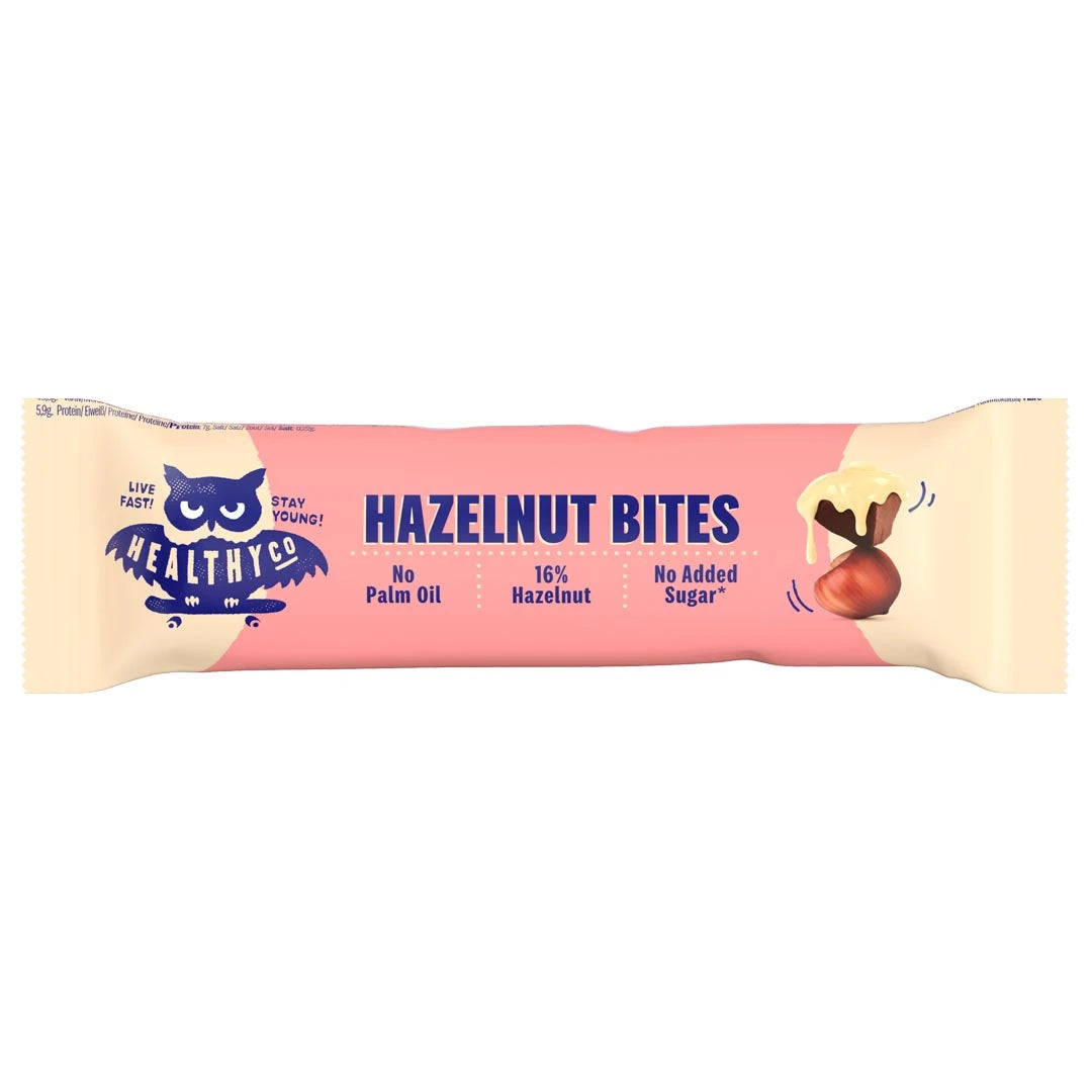 Healthyco Hazelnut Bites 21 g chokladbit i en rosa och ljusbeige förpackning med mörkblå text., bild 1 av 1