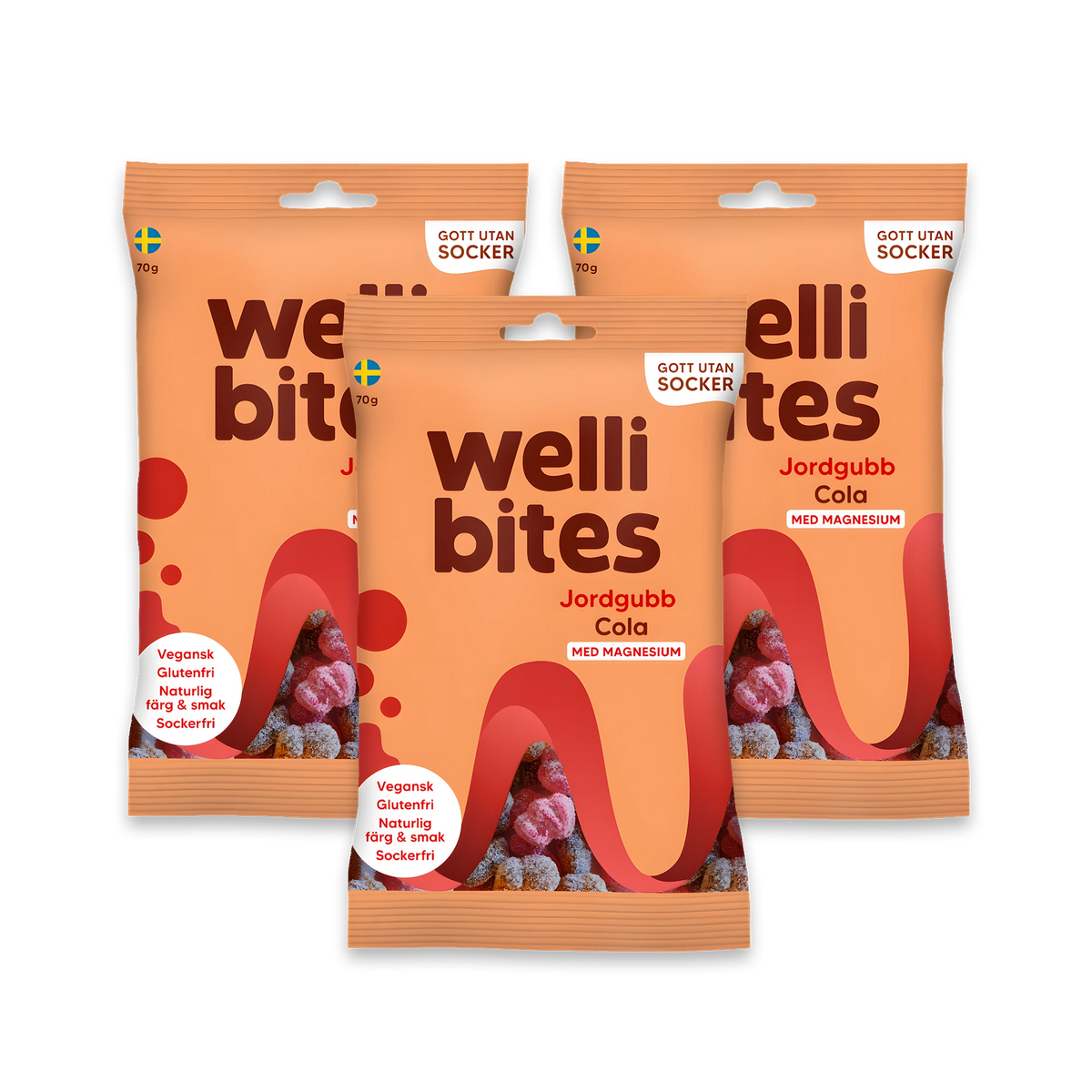 3 x Wellibites Candy 70 g Jordgubb & Cola i tre ljust orangea godispåsar med röda och svarta detaljer.