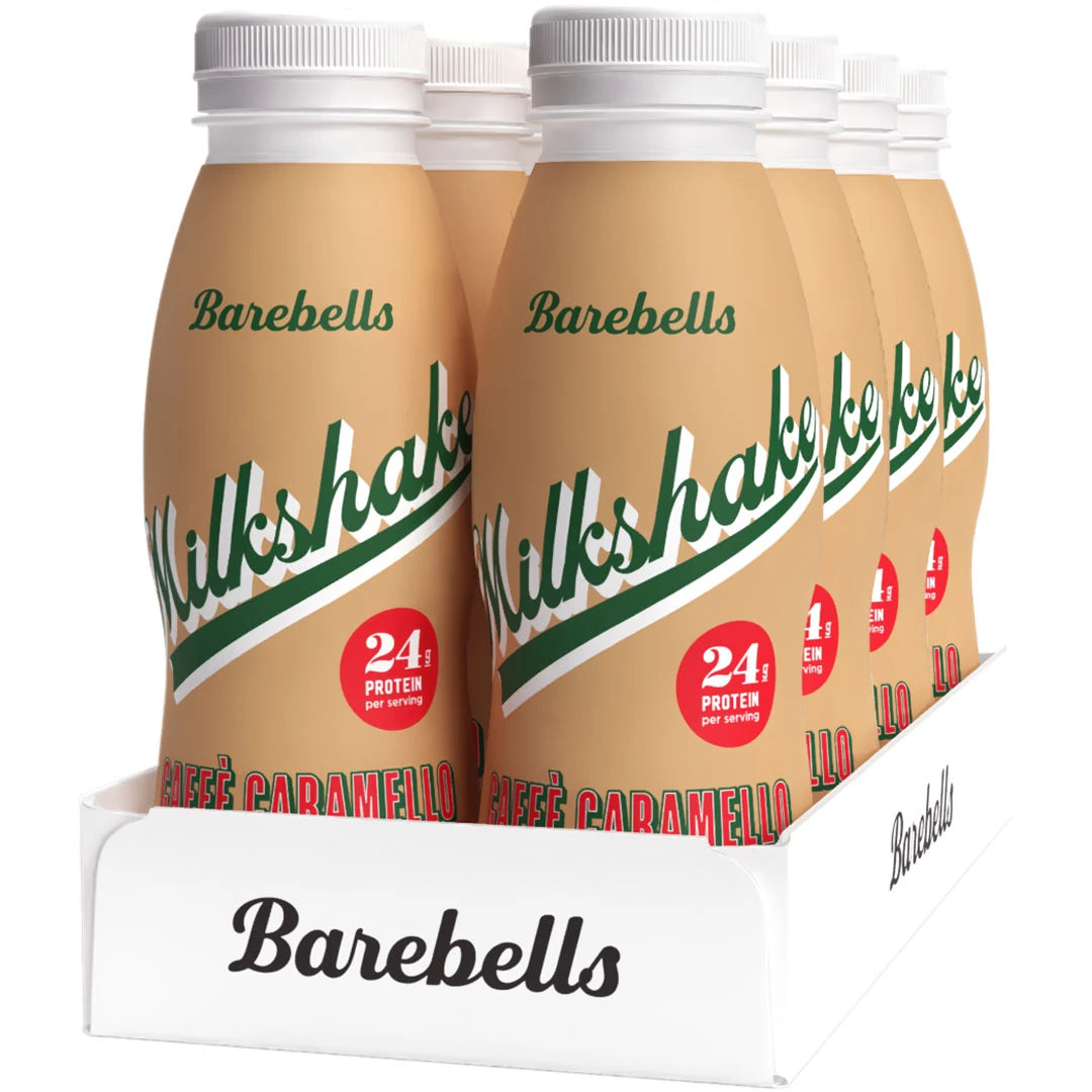 8 x Barebells Milkshake 330 ml Caffé Caramello i ett vitt tråg med ljusbruna flaskor och gröna detaljer., bild 1 av 1
