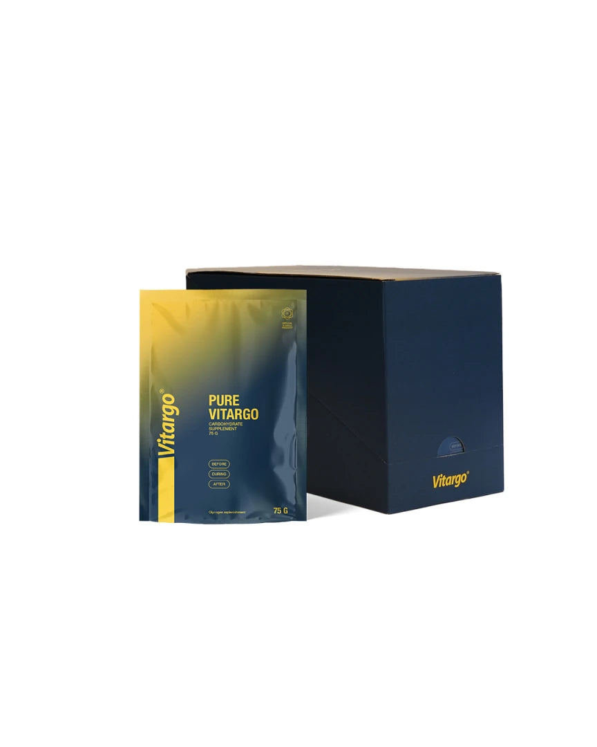 Vitargo Pure 15 x 75 g kolhydrater förpackade i en mörkblå låda med en portionspåse framför i gult och blått., bild 1 av 1