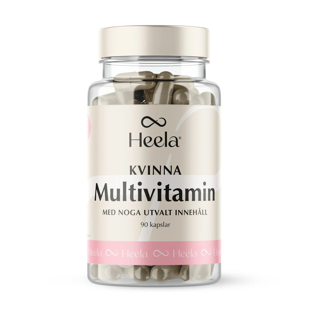 Heela Multivitamin Woman 60 caps i en genomskinlig burk med ljust lock och en beige etikett med rosa detaljer., bild 1 av 1
