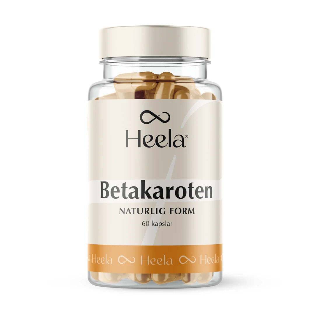 Heela Betakaroten 25 mg 60 caps i en transparent burk med beige etikett och vita detaljer, fylld med guldfärgade kapslar., bild 1 av 1