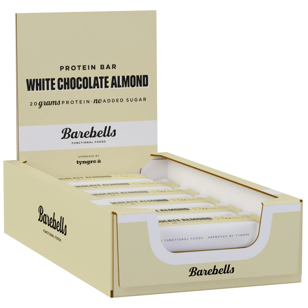 12 x Barebells Protein Bar 55 g White Chocolate Almond i en beige displaykartong med vita detaljer och svarta texter., bild 1 av 1