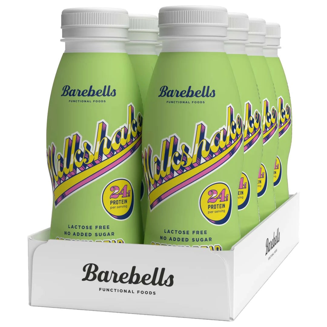 8 x Barebells Milkshake 330 ml Creamy Pear i en vit kartong med ljusgröna flaskor och retroinspirerad text., bild 1 av 1