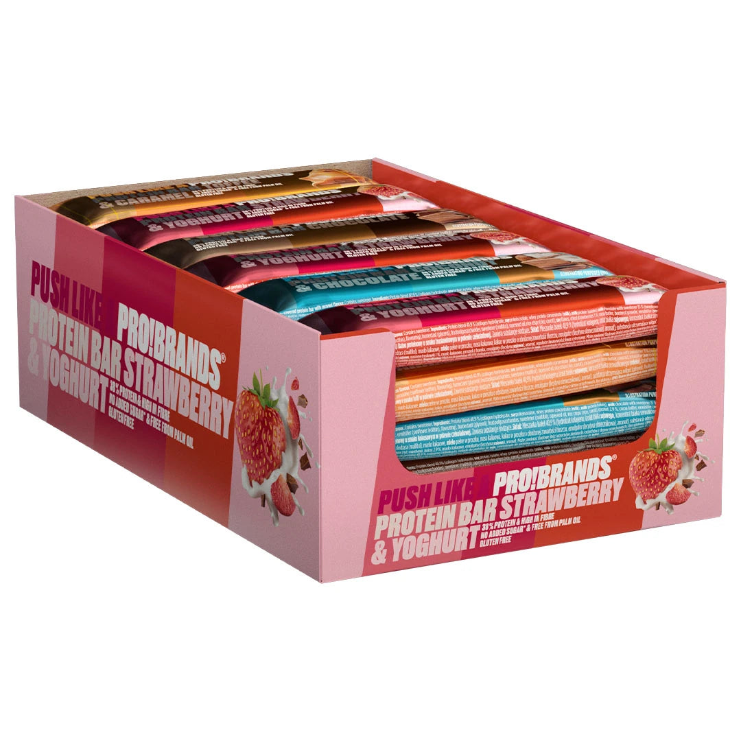 24 x Pro Brands Proteinbar 45 g Mixpack i en rosa displaylåda fylld med proteinbars i olika smaker.