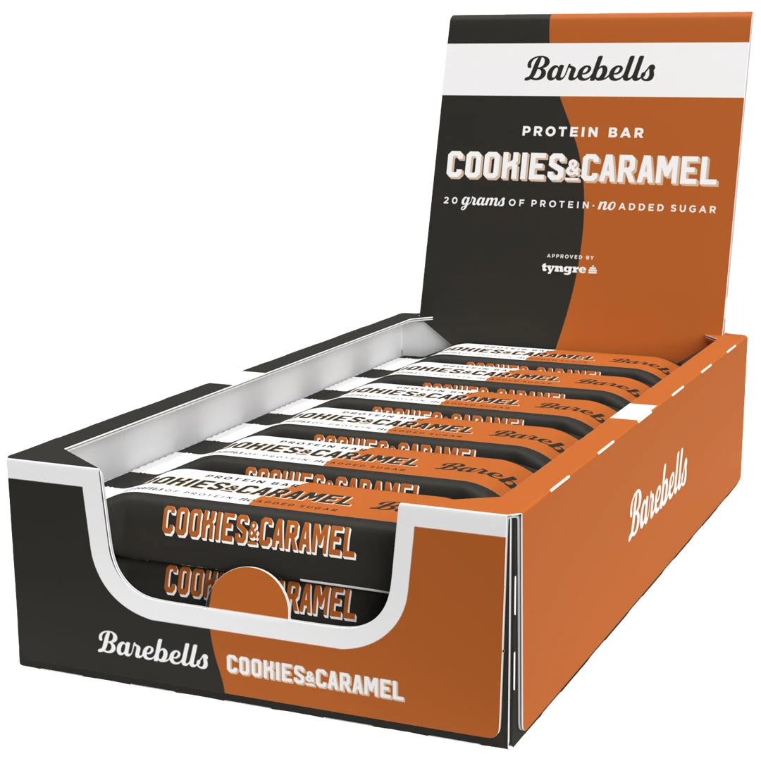 12 x Barebells Protein Bar 55 g Cookies &amp; Caramel i en brun och svart öppen displaybox med matchande proteinbars., bild 1 av 1