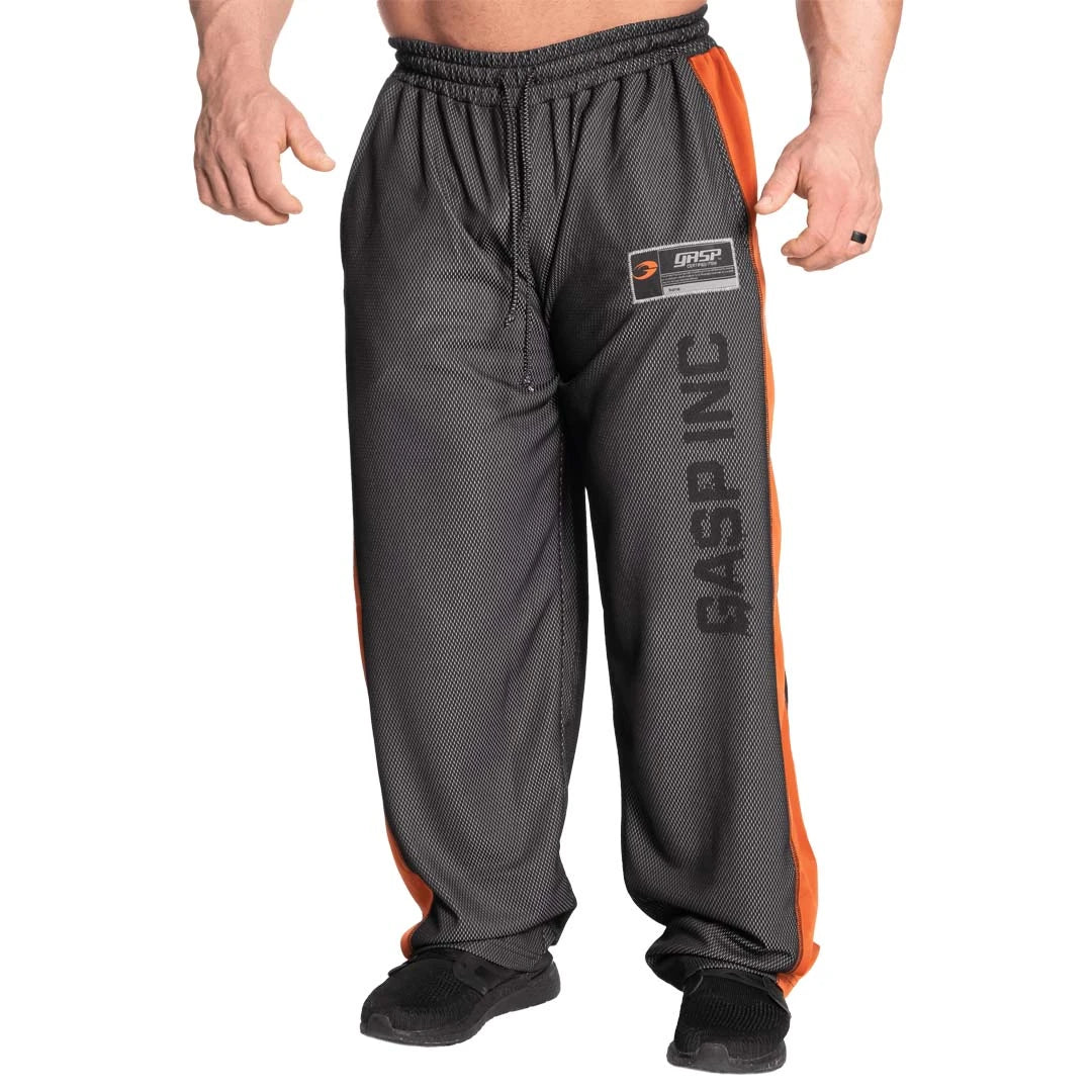 GASP No 1 Mesh Pant Black Flame, svarta rymliga träningsbyxor i luftig mesh med orange sidopaneler och stort logotryck.