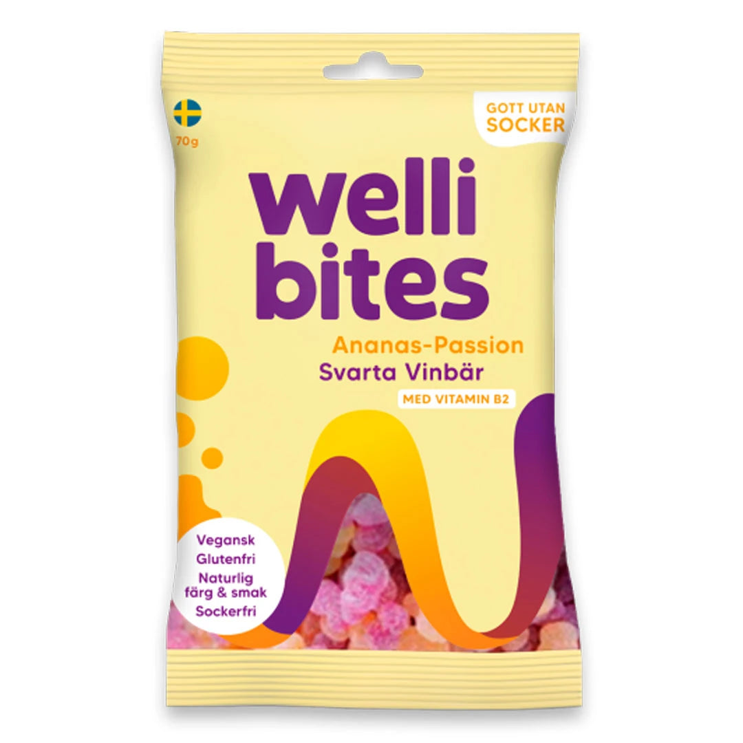 Wellibites Candy 70 g i en ljusgul påse med lila och orange detaljer för smaken Ananas-passion &amp; svarta vinbär., bild 3 av 6