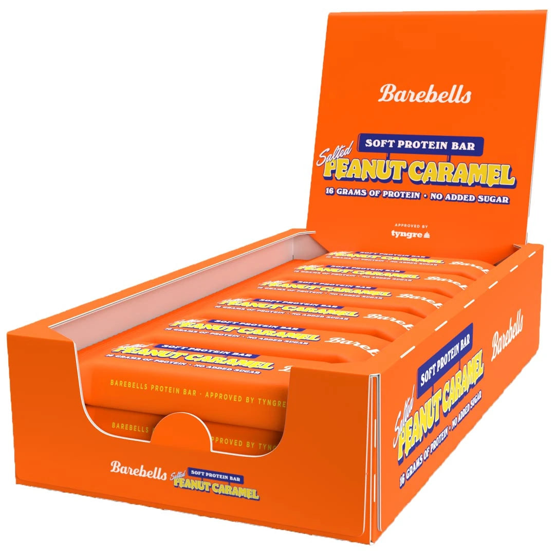 12 x Barebells Soft Protein Bar 55 g Salted Peanut Caramel i en orange displaybox fylld med matchande bars., bild 1 av 1